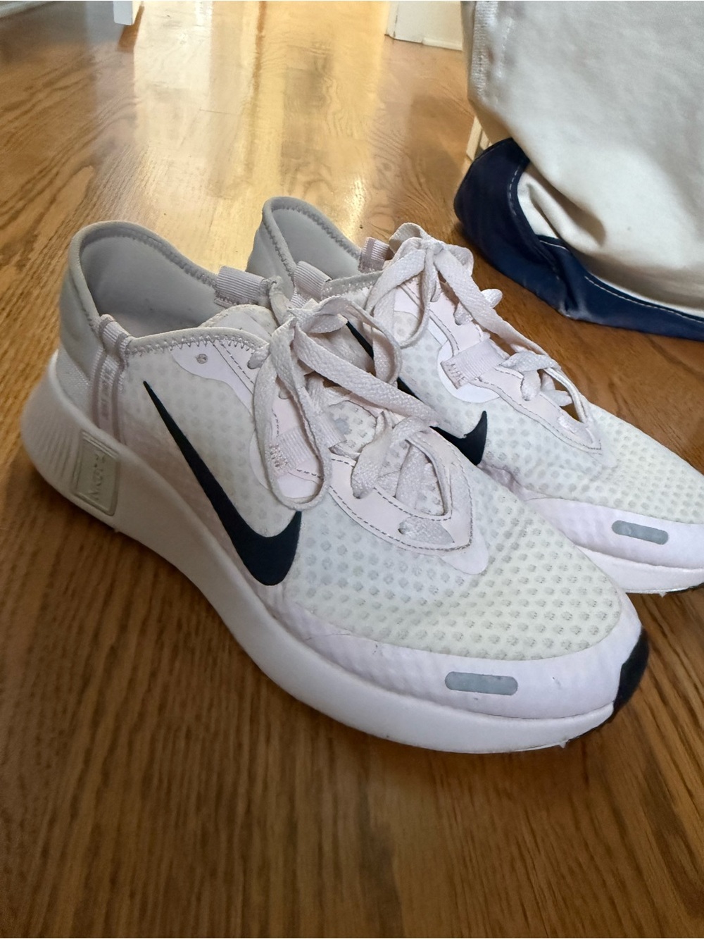 Nike White and Light Pink Sneakers with Black Swoosh